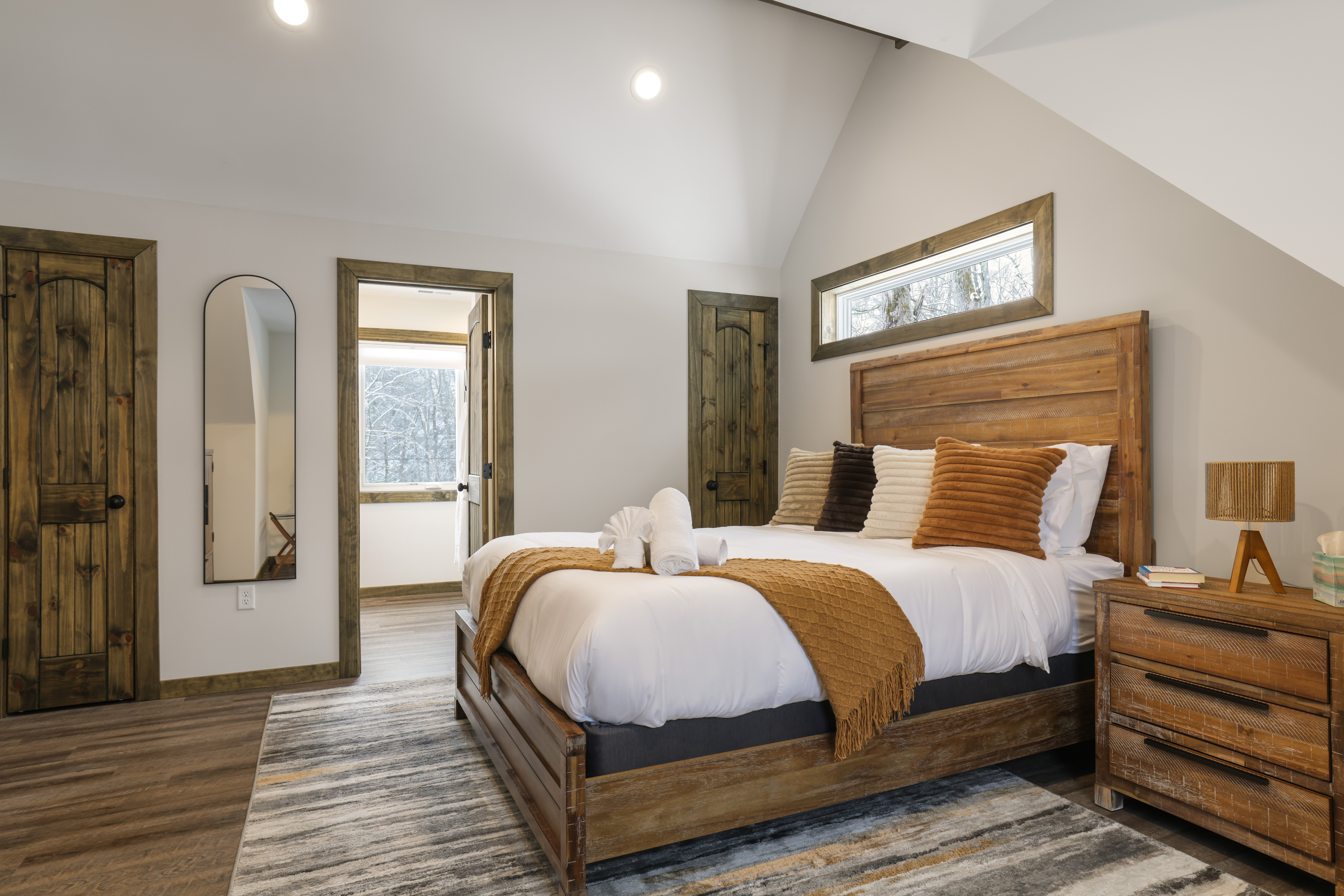 Master bedroom with rustic wood accents
